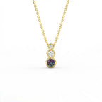Tria Aura Diamond and Alexandrite Necklace in 14K yellow gold with three stone bezel design and alexandrite center
