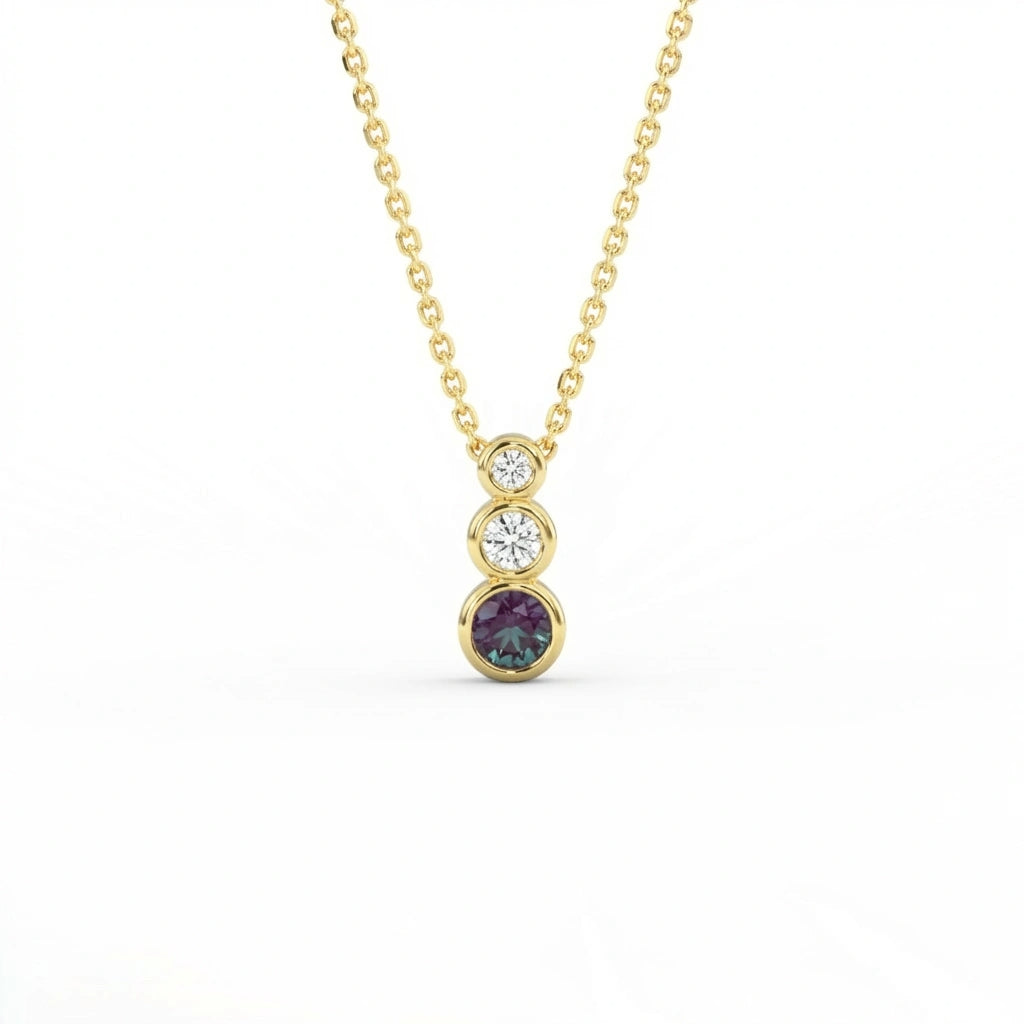 Tria Aura Diamond and Alexandrite Necklace in 14K yellow gold with three stone bezel design and alexandrite center