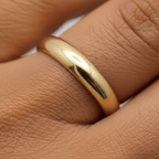 4mm gold wedding band showing smooth dome finish