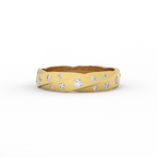 Textured 14K gold diamond wedding band with scattered round diamonds
