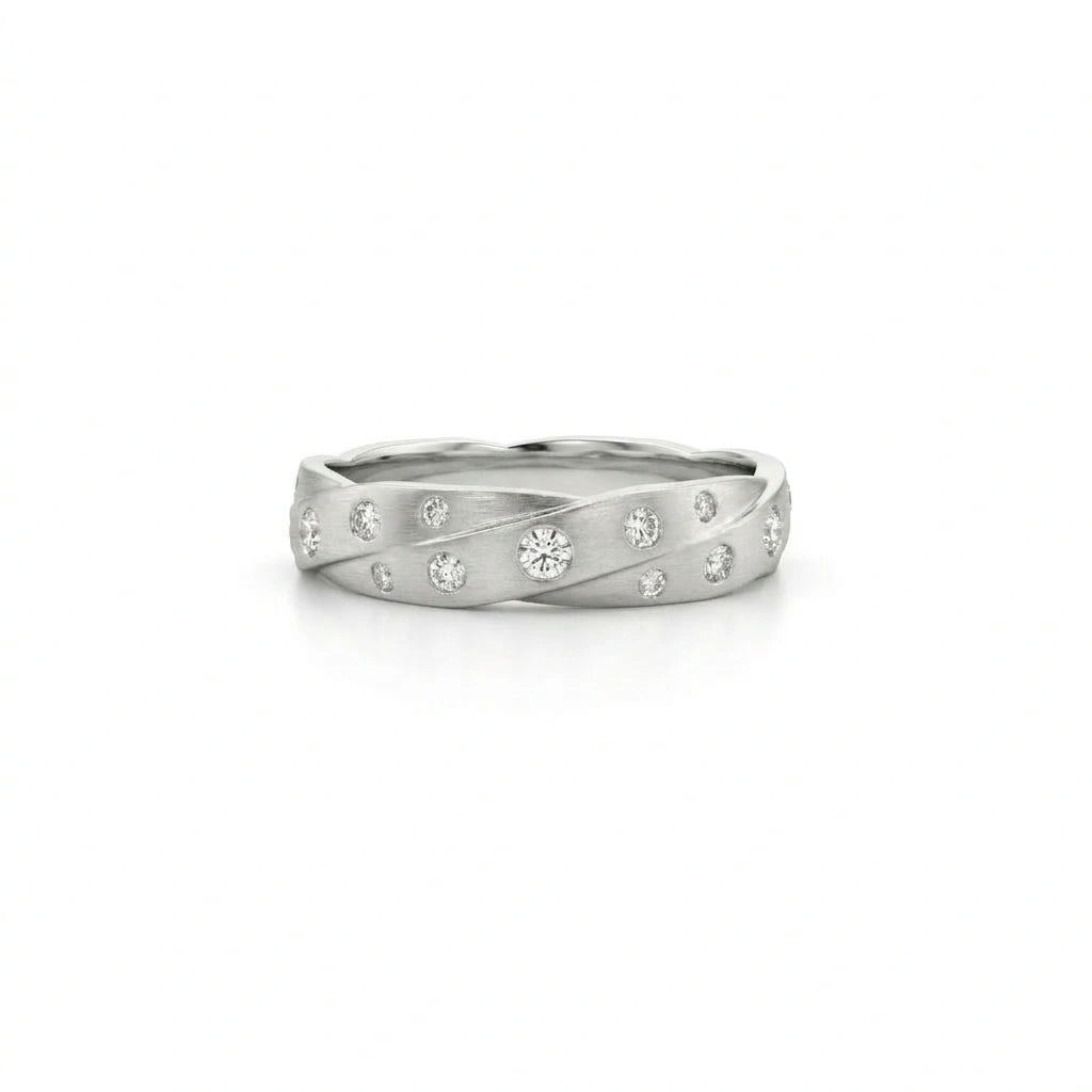 Handmade 14K gold twisted satin diamond wedding band showing diamond placement along the band