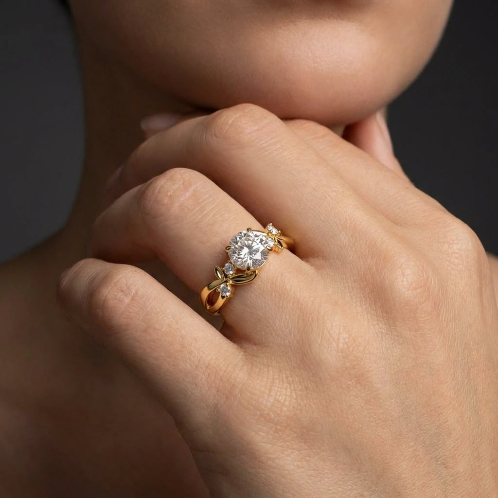 Woman wearing twisted vine round diamond engagement ring in 14k yellow gold on hand