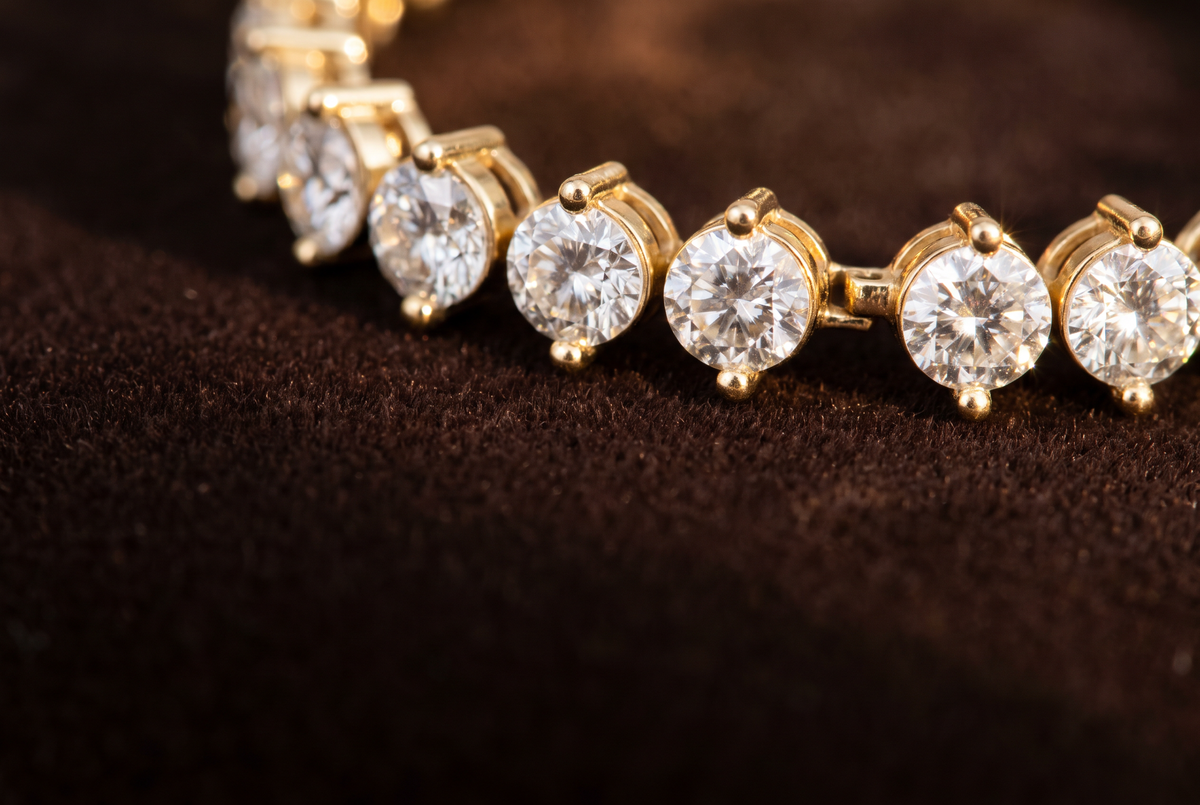 Two-prong lab-grown diamond tennis bracelet in 14K yellow gold, north-south prongs, close-up