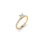 Angled view of ultra thin princess cut pavé engagement ring with diamond band