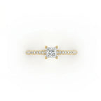 Top view of ultra thin princess cut pavé ring in solid 14k yellow gold