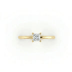 Top view of ultra thin princess cut solitaire ring with slim yellow gold band