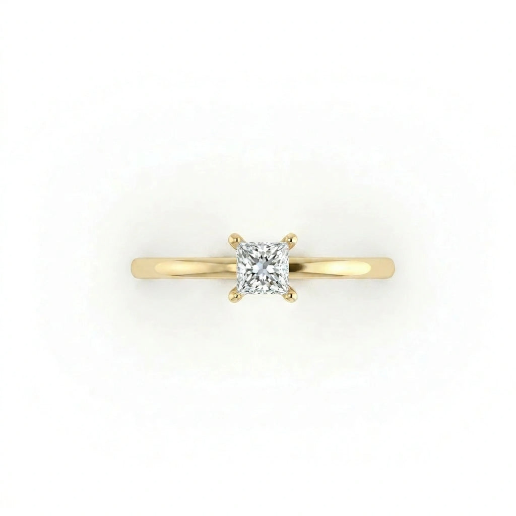 Top view of ultra thin princess cut solitaire ring with slim yellow gold band
