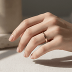 flat gold wedding band worn on hand