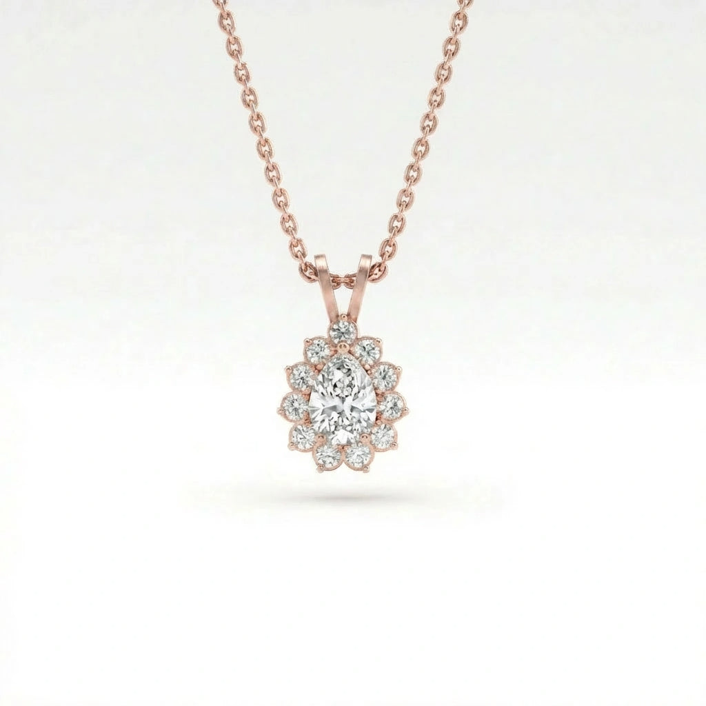 Valeria halo pendant in 14K rose gold featuring pear-cut diamond center and round diamond halo, front view