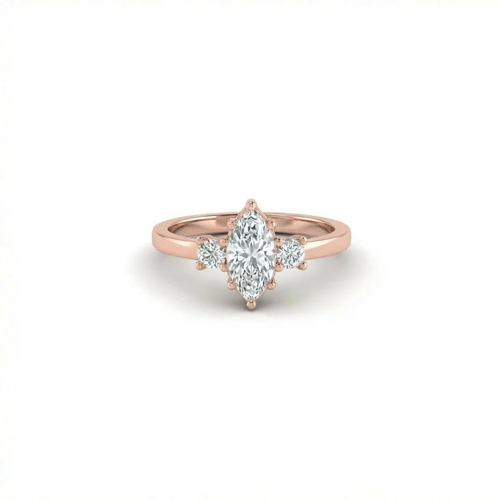 Vela marquise diamond engagement ring in solid 14K rose gold with marquise center diamond and round side stones, three-stone design front view