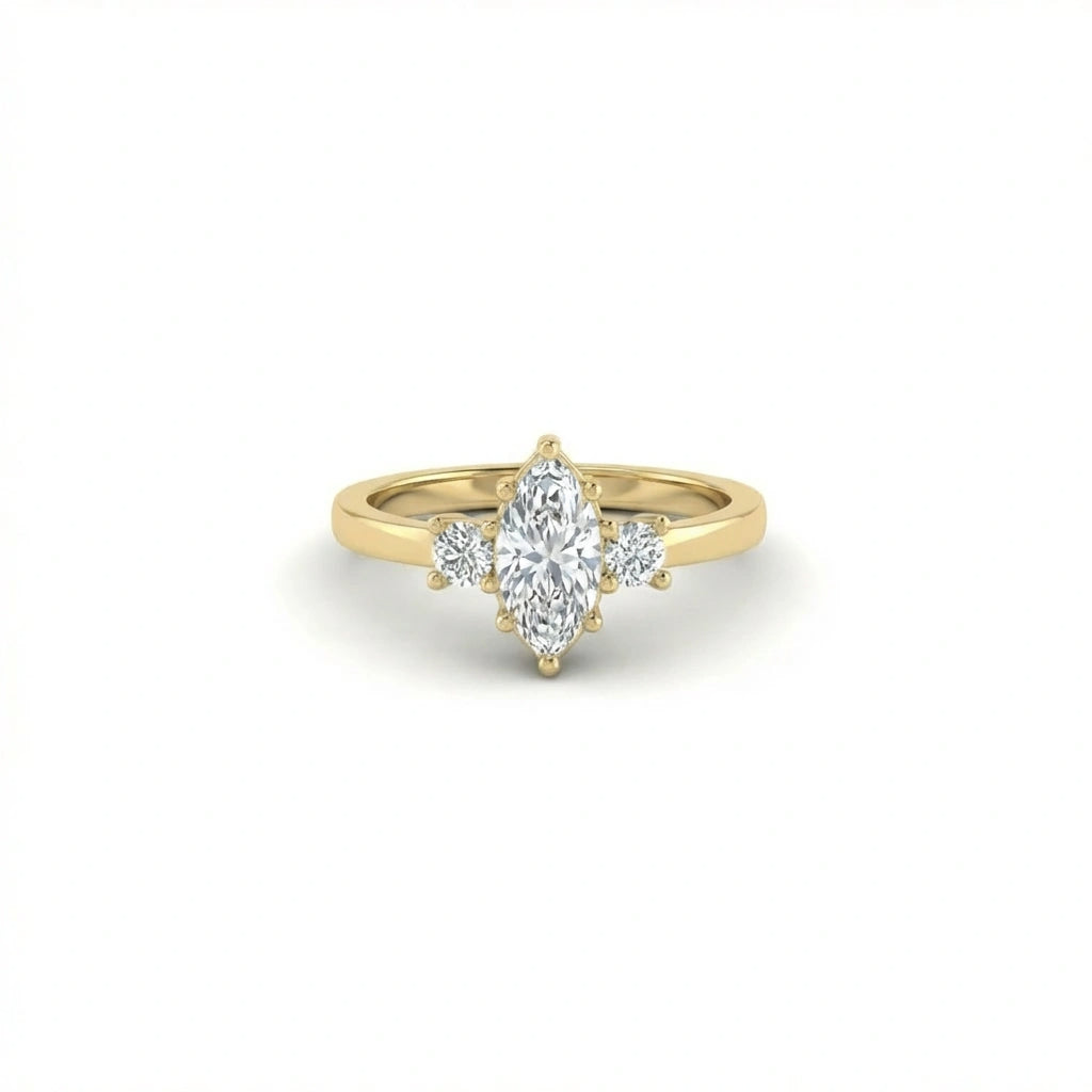 Vela marquise diamond engagement ring in 14K yellow gold with three-stone setting, marquise center diamond and round side stones, front view