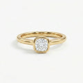 Solid 14K yellow gold cushion cut diamond ring with bezel set center stone and sleek band