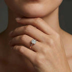 Model wearing cushion cut diamond ring in solid gold with bezel setting and refined minimalist design
