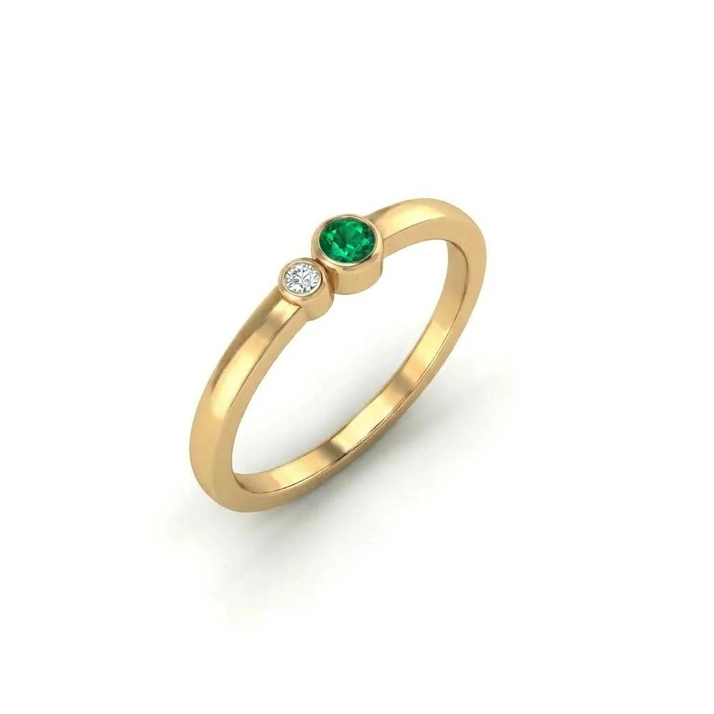 Bezel set emerald and diamond ring angled perspective minimalist design