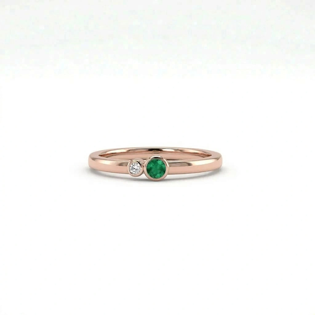Minimalist emerald and diamond bezel ring in 14k rose gold