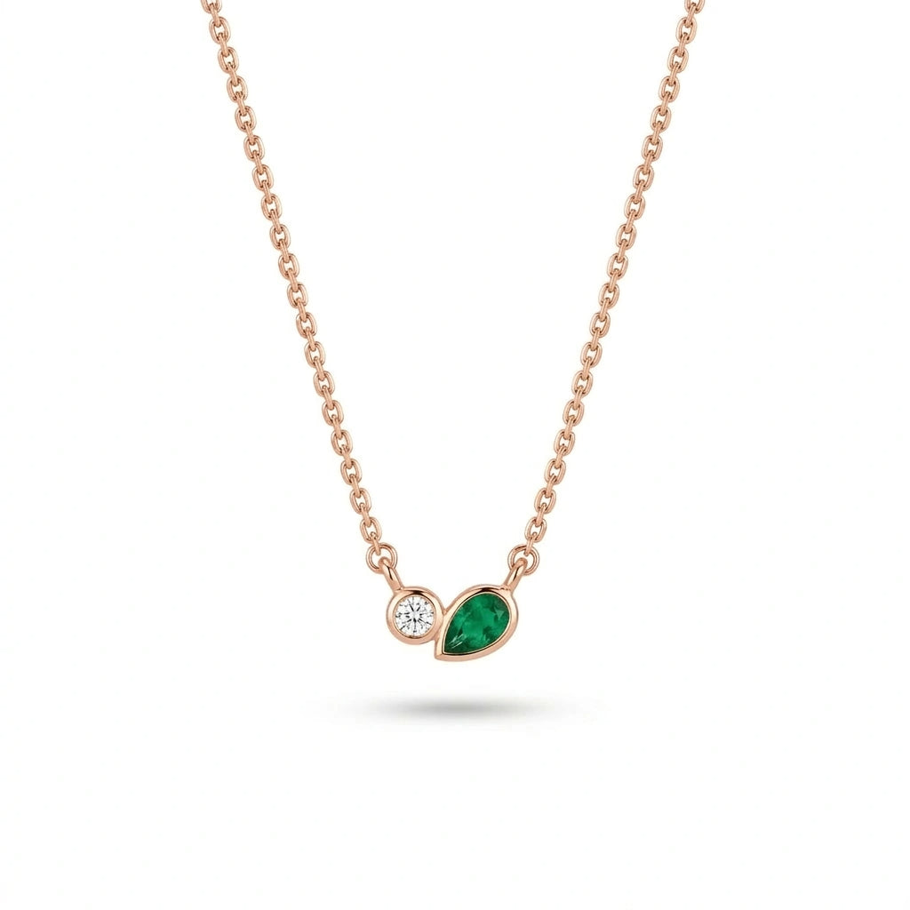 Delicate diamond and emerald pendant necklace in 14k rose gold