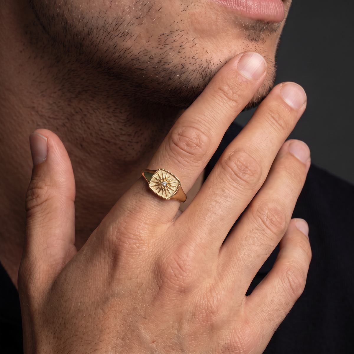 Greek Vergina Sun signet ring in 14K gold worn on a man's hand