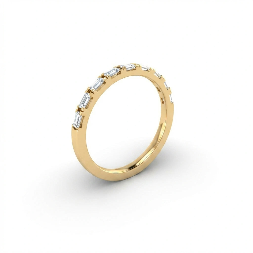 Virel Baguette Diamond Half Eternity Band in 14K yellow gold, angled side view showing profile of slim band with horizontal bar-set baguette diamonds and plain gold shank