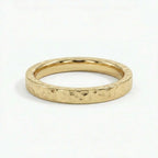 Virel hammered gold band in solid 14K yellow gold with organic textured surface and minimalist design
