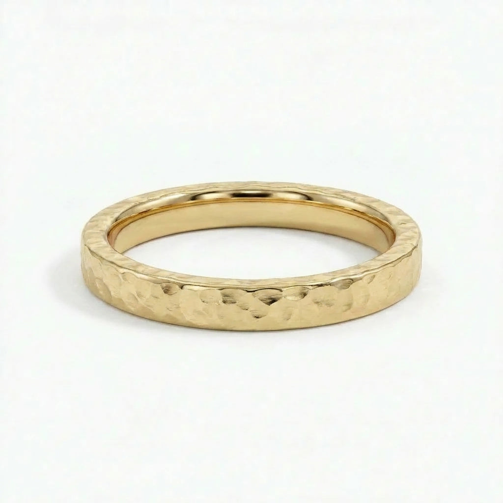 Virel hammered gold band in solid 14K yellow gold with organic textured surface and minimalist design