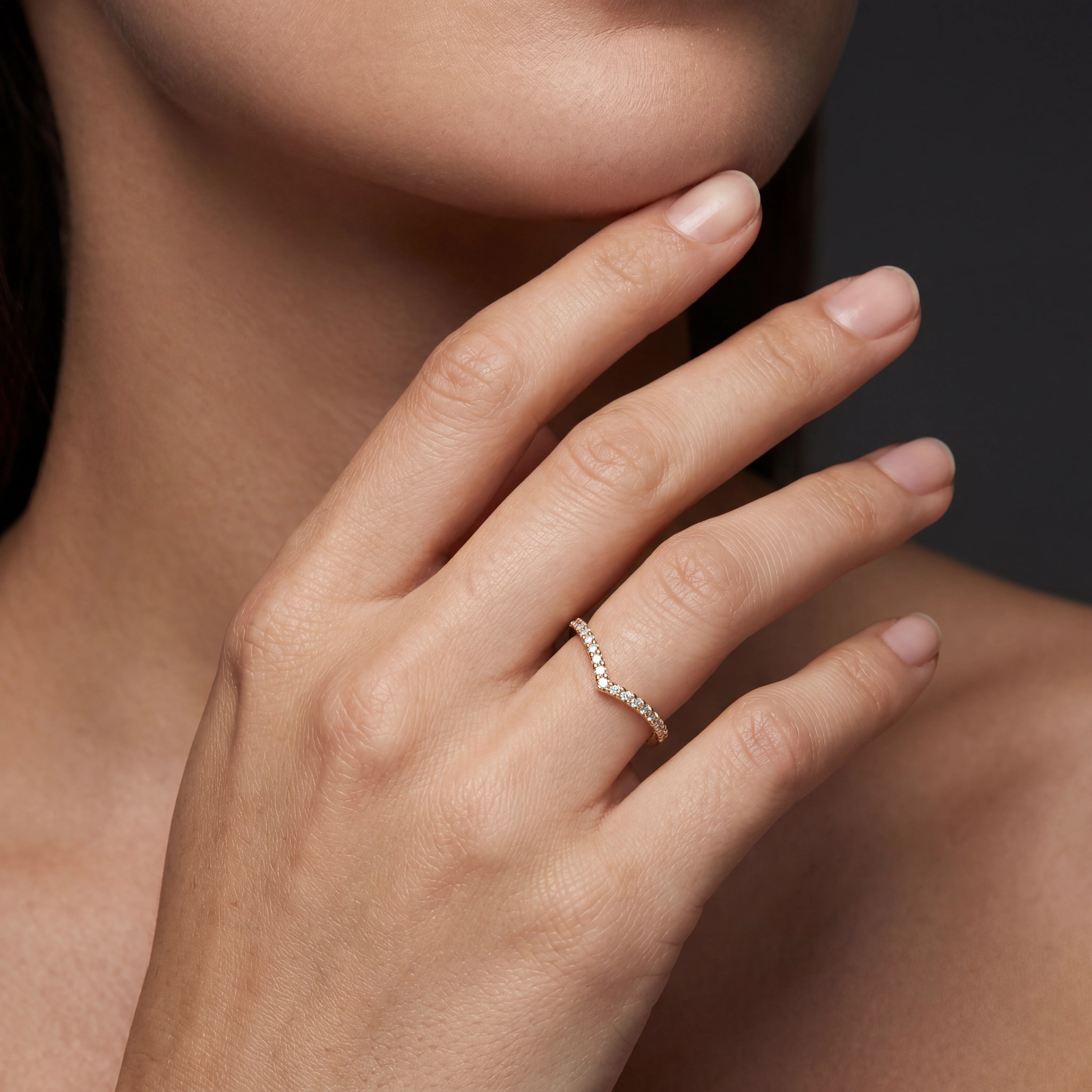 Model wearing wishbone pavé diamond wedding band in 14K rose gold, close-up — Black Pearl of Queens
