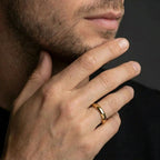 Man wearing the 4mm 14K yellow gold Triborough dome wedding band