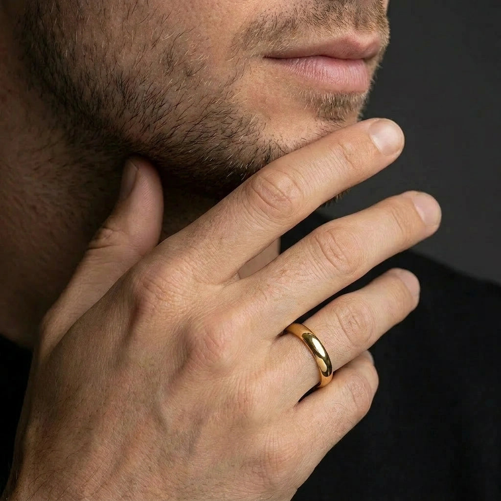 Man wearing the 4mm 14K yellow gold Triborough dome wedding band