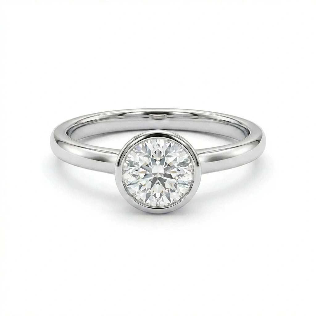 Zevar round diamond bezel ring in solid 14K white gold with polished minimalist band