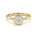 Zevar round diamond bezel set ring in solid 14K yellow gold with classic polished band