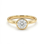 Zevar round diamond bezel set ring in solid 14K yellow gold with classic polished band