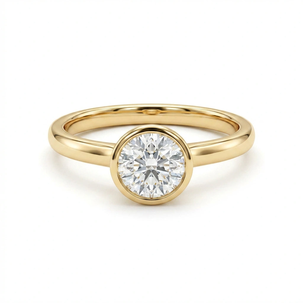 Zevar round diamond bezel set ring in solid 14K yellow gold with classic polished band