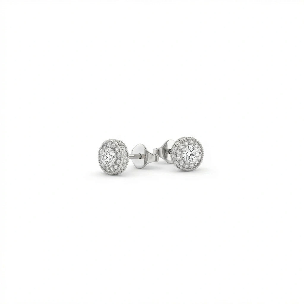 Zirelle diamond halo stud earrings in solid white gold featuring round center diamond with pavé halo