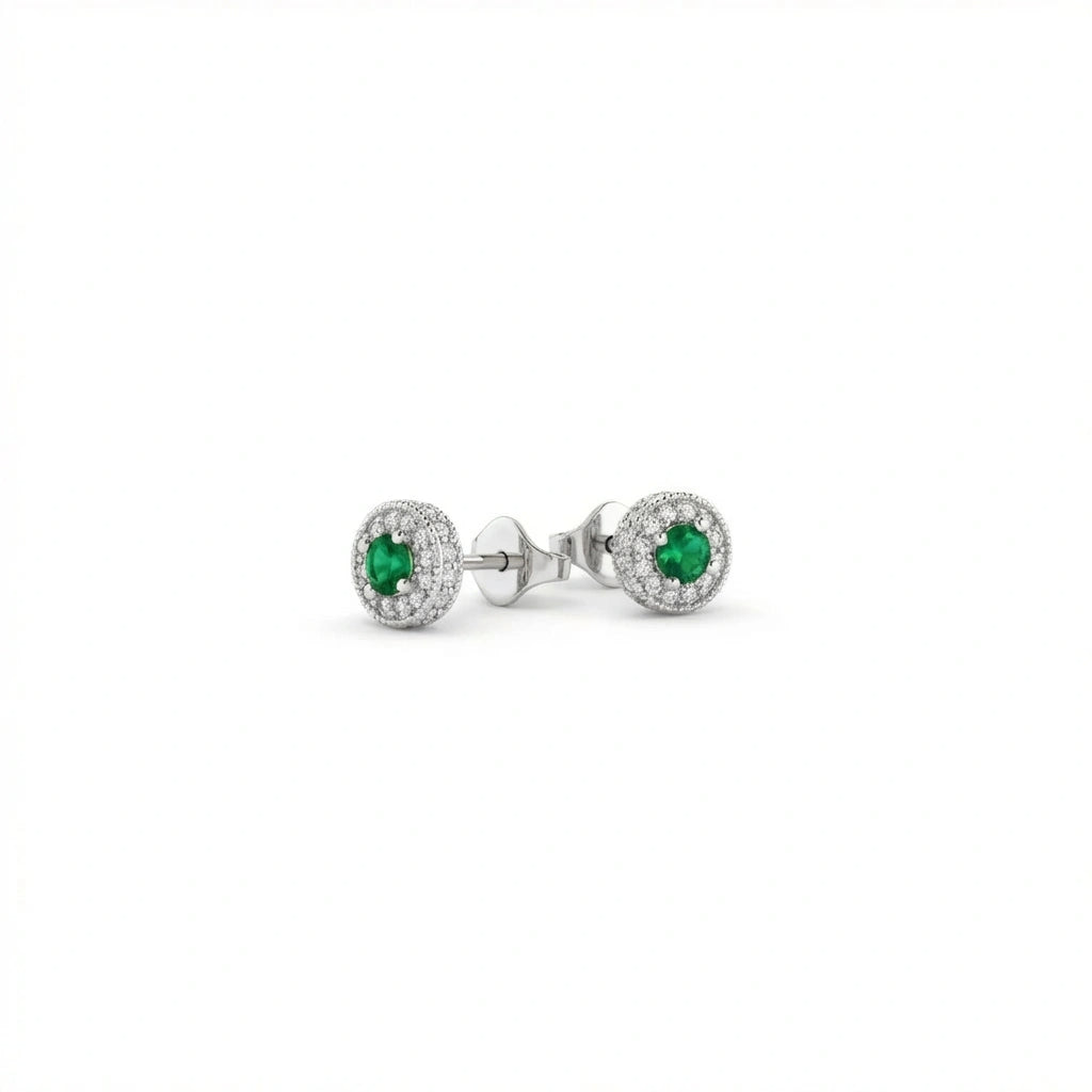 Zirelle emerald halo stud earrings in solid white gold featuring round green emerald center stones surrounded by diamond halo