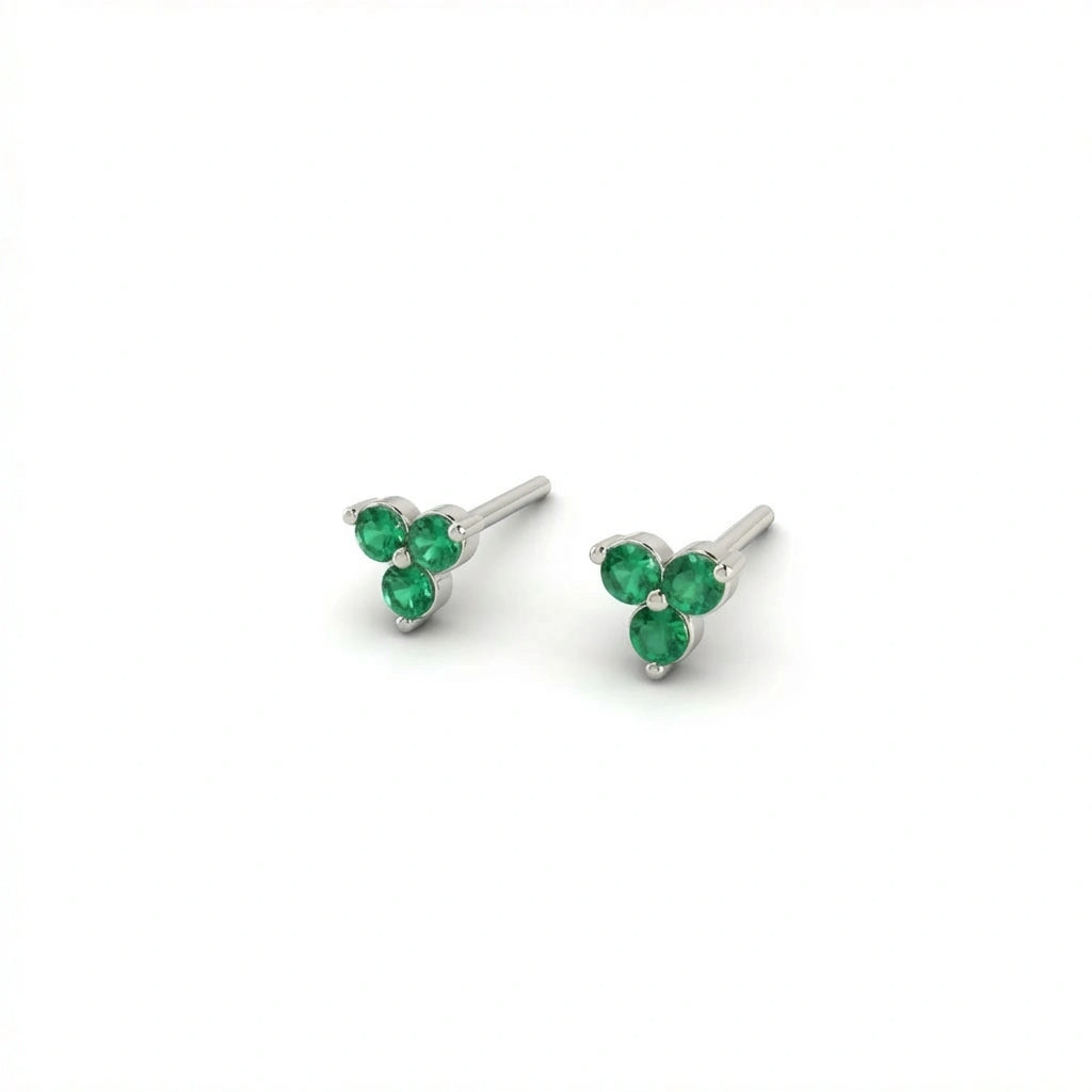 Zirelle emerald triad stud earrings in solid white gold with three round green stones in minimal cluster setting